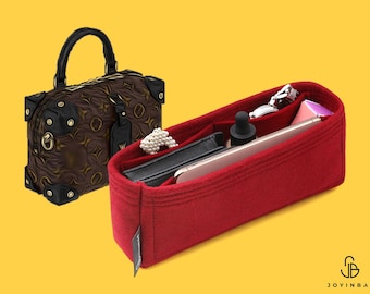 May include: A brown patterned handbag with black leather accents and a rectangular red felt bag organizer insert. The organizer contains a black wallet, a smartphone, a dropper bottle, a string of white pearls, and a small silver metal object.