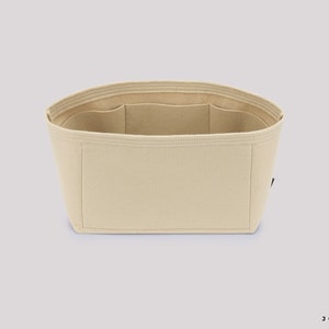 Pu&ograve; includere: Organizzatore per borsa in feltro beige con pi&ugrave; scomparti. L'organizzatore &egrave; progettato per adattarsi all'interno di una borsa pi&ugrave; grande e aiutare a mantenerla organizzata.