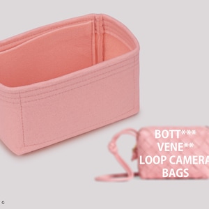 May include: Pink felt bag organizer with multiple compartments. The organizer is designed to fit inside a Bottega Veneta Loop Camera Bag.
