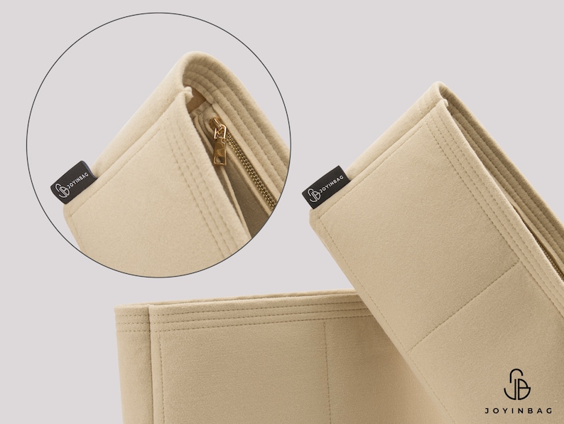 Op de afbeelding: Beige feltaschenorganizer met meerdere vakken en een ritsvak. De organizer heeft een zwart label met de tekst "Joyinbag".