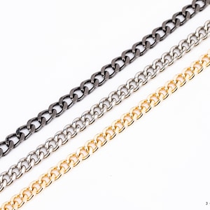 May include: Three chains in different finishes: black, silver, and gold. The chains are all the same style, with a curb link design.