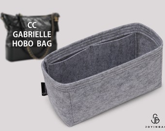 Könnte beinhalten: Grauer Filztaschenorganizer mit mehreren Fächern und einem Etikett mit der Aufschrift "Joyinbag".