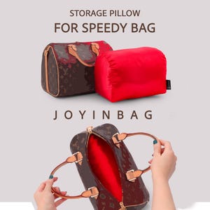 May include: A red storage pillow for a Speedy bag, labeled STORAGE PILLOW FOR SPEEDY BAG and JOYINBAG. The pillow is shown next to a brown monogrammed handbag and inserted inside the bag, which has tan leather handles and gold hardware.