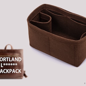 May include: Brown felt bag organizer with multiple compartments. The organizer is designed to fit inside a brown leather backpack with the text "PORTLAND L***** BACKPACK".