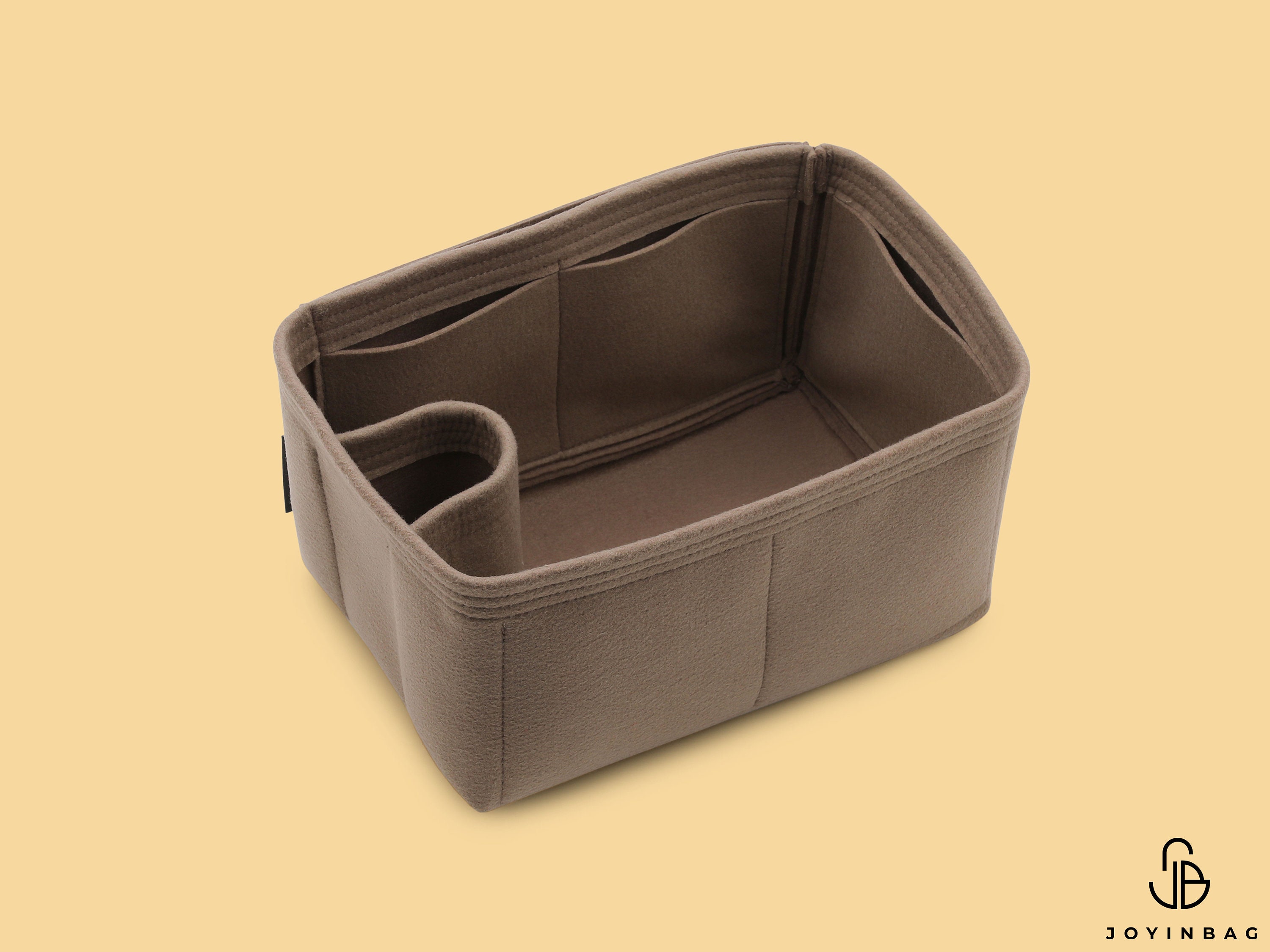 Can you cinch the Neverfull with a Samorga organizer inside? 