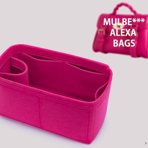 May include: Pink felt bag organiser with multiple compartments and a small pocket. The organiser is designed to fit inside a Mulberry Alexa bag.