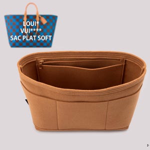 May include: A brown felt bag organizer with multiple compartments and a zippered pocket. The organizer is designed to fit inside a handbag.