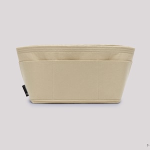 Pu&ograve; includere: Organizzatore per borsa in feltro beige con pi&ugrave; scomparti e un'etichetta nera che dice "JOYINBAG".