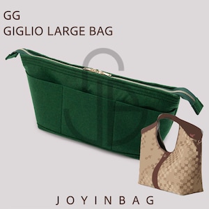 May include: A dark green bag organizer with multiple pockets and a gold zipper. The text "GG GIGLIO LARGE BAG" is at the top, and "JOYINBAG" is at the bottom. A patterned handbag is also in the image.