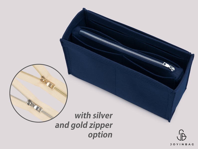 May include: A navy blue felt bag organizer with multiple compartments and a zipper closure. The zipper is available in silver and gold.