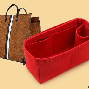 May include: Red felt bag organizer with multiple compartments and a zippered pocket. The organizer is designed to fit inside a larger tote bag.