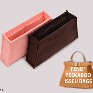 May include: Two felt bag organizers, one pink and one brown, designed to fit inside a Fendi Peekaboo handbag. The organizers have multiple compartments and pockets to help keep your bag organized.