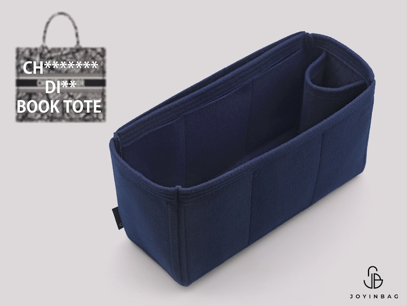 May include: A navy blue felt bag organizer with multiple compartments and a zippered pocket. The organizer is designed to fit inside a larger tote bag.