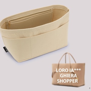 May include: Beige felt bag organiser with multiple pockets and a zipped top. The organiser is designed to fit inside a larger tote bag. The text "LORO IA*** GHIERA SHOPPER" is printed on a beige tote bag.