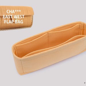 May include: A light orange felt handbag organizer insert with multiple interior compartments and open top, shown alongside a tan quilted rectangular flap bag with the text CHA*** EAST WEST FLAP BAG printed on the surface of the bag.