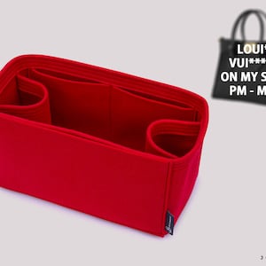 May include: Red felt bag organizer with multiple compartments and pockets. The organizer is designed to fit a Louis Vuitton On My Side PM or MM handbag. The text "LOUIS VUITTON ON MY SIDE PM - MM" is visible on the handbag.