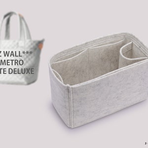 May include: White felt bag organizer with multiple compartments. The organizer is designed to fit inside a tote bag. The text "MZ WALL*** METRO TOTE DELUXE" is visible on the bag.