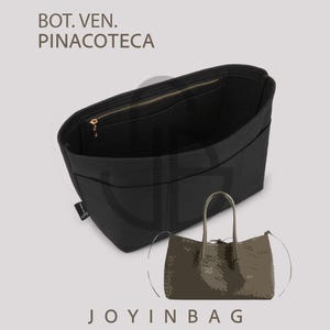 May include: Black handbag organiser with a gold zip and multiple compartments. The organiser is shown with a brown tote bag. The text "BOT. VEN. PINACOTECA" and "JOYINBAG" are visible.