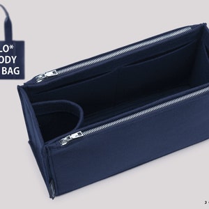 May include: A navy blue felt bag organiser with multiple compartments and zipper closures. The organiser is designed to fit inside a Chloe Woody Tote Bag.