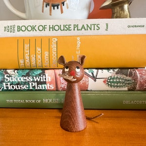 Danish Teak Cat with Mouse tail in Mouth