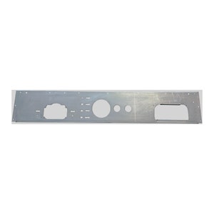 May include: A silver-colored metal panel with various cut-out shapes and holes. The panel has a rectangular shape with a large, rounded rectangular opening on the right side and a large circular opening in the center. Smaller circular and rectangular holes are also present.