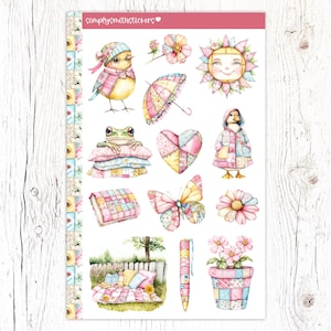 May include: A sheet of colorful stickers featuring a variety of cute illustrations, including a bird, a frog, a duck, a flower, a heart, a sun, a butterfly, and a potted plant. The stickers are all on a white background with a pink border.