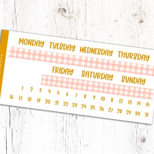 May include: A printable calendar planner with a pink and white gingham pattern. The days of the week are labeled in yellow text, and the numbers 1 through 31 are listed below.
