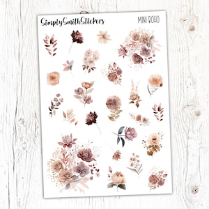 May include: A sheet of mini boho stickers featuring various floral designs in shades of brown, pink, and white. The stickers are perfect for adding a touch of whimsy to planners, journals, and other craft projects.