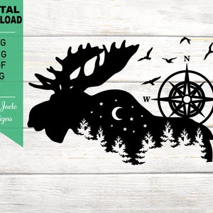 May include: Black silhouette of a moose with a compass and stars in the background. The moose is standing in a forest with trees and a crescent moon. The compass has the letters N, S, E, and W.