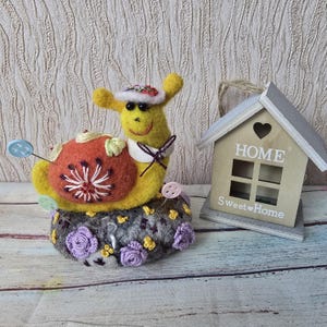 Felted snail pincushion on wool stone