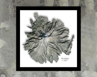 May include: A black and white topographic map of Mount Hood, a mountain in Oregon, with the text "Mt Hood 11,250'" at the bottom.
