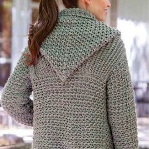 May include: A long-sleeved, hooded cardigan sweater in a light gray color. The sweater is knitted with a textured pattern and has a relaxed fit.