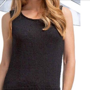 May include: A black sleeveless knitted tank top with a scoop neck.
