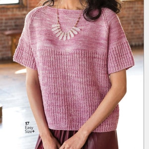May include: A pink and white knit sweater with a boat neck and short sleeves. The sweater has a textured pattern and a slightly cropped length.