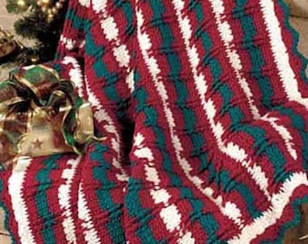 May include: A crocheted throw blanket with a striped pattern in red, white, and teal.