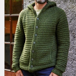 May include: A green hooded cardigan with a button-up front and a waffle knit texture.