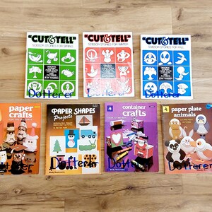 May include: A collection of seven instructional craft books featuring titles such as Cut & Tell Scissor Stories for Spring, Winter, and Fall, Paper Crafts for the Holidays, Paper Shapes Projects, Container Crafts, and Paper Plate Animals with illustrations.