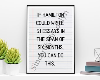 May include: A motivational quote on a white background with blue lines, framed in black. The quote reads: "If Hamilton could write 51 essays in the span of six months, you can do this."