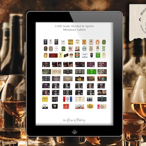 May include: A digital display shows miniature labels for alcohol and spirits. The labels are arranged in rows and columns. The display is surrounded by glasses of amber liquid and bottles. The text "1:12th Scale Alcohol & Spirits Miniature Labels" is visible.