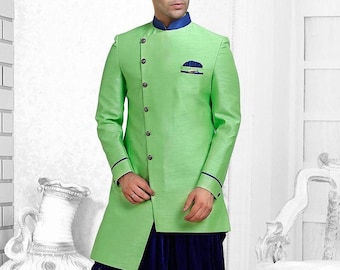 May include: A light green long-sleeved kurta with a blue trim and a single button closure. The kurta is paired with dark blue dhoti pants.