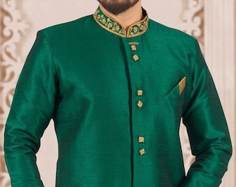 May include: A long-sleeved green kurta with gold embroidery around the collar and cuffs. The kurta has a mandarin collar and a button closure.