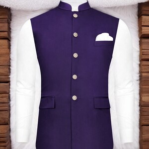 May include: A purple waistcoat with a mandarin collar and five silver buttons. The waistcoat has a pocket on the right side and two pockets on the bottom.