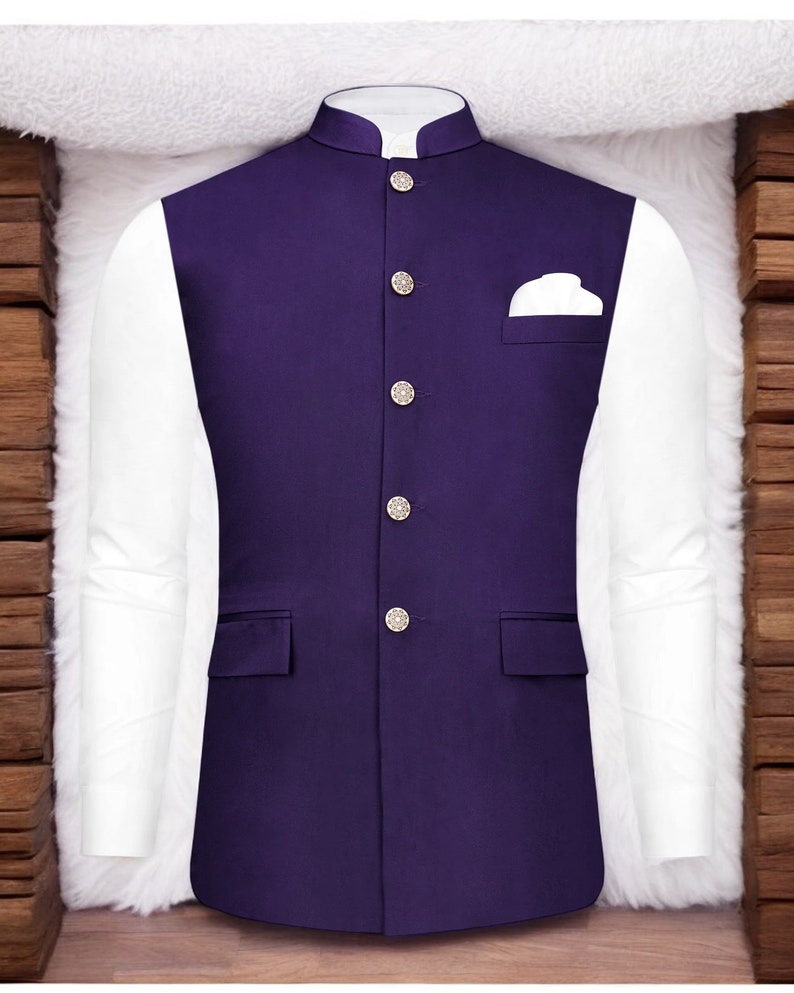 May include: A purple waistcoat with a mandarin collar and five silver buttons. The waistcoat has a pocket on the right side and two pockets on the bottom.