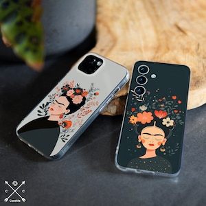 May include: Two phone cases with a floral Frida Kahlo design. One case is clear with a floral design and the other is dark with a floral design. The cases feature a portrait of Frida Kahlo with flowers in her hair.