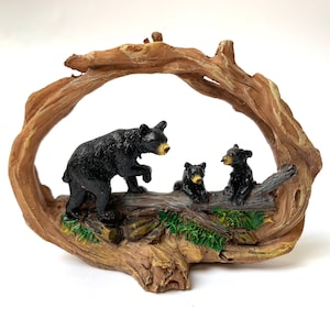 Black bear taking her cubs