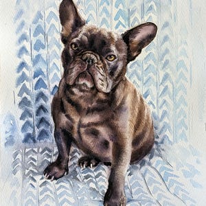 May include: A watercolor painting of a dark brown French Bulldog with large upright ears and amber eyes. The dog is sitting in a forward-facing position against a light blue and white background featuring a repeating chevron or arrow pattern.