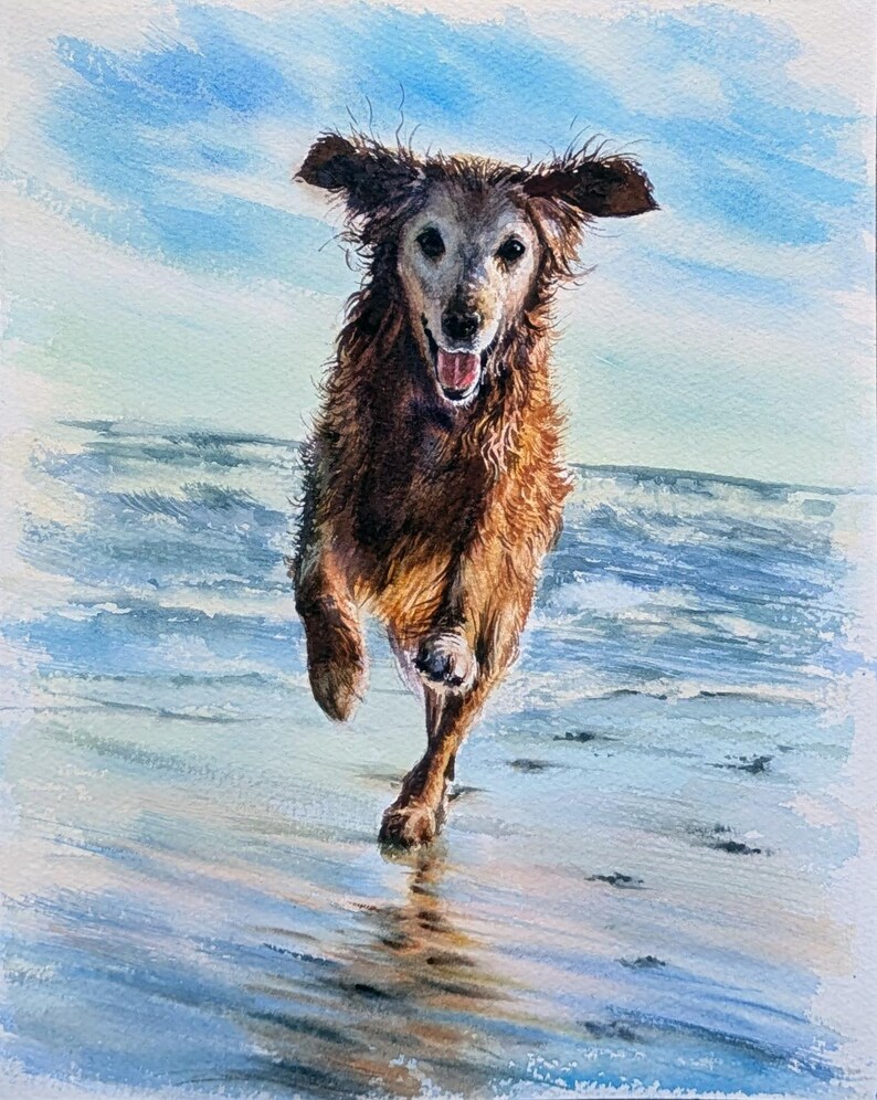 May include: A watercolor painting of a golden-brown dog with a white muzzle running forward on a wet sandy beach. The dog has its mouth open in a happy expression, with ears slightly lifted. The background features blue ocean waves and sky.