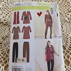 May include: Simplicity sewing pattern 1593AA featuring a vest, jacket, top, and pants. The pattern includes size options from US 10-18. The image shows a woman wearing the finished garments. The price tag shows $17.95.