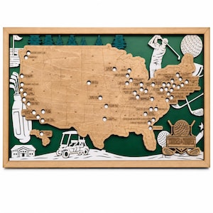 May include: A framed wooden map of the United States featuring laser-cut golf course locations, a golfer silhouette, a golf cart, and a golf bag. The map is set against a dark green background with white accents and the text Courses & Conquers.