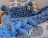Merino wool baby blanket with pom poms